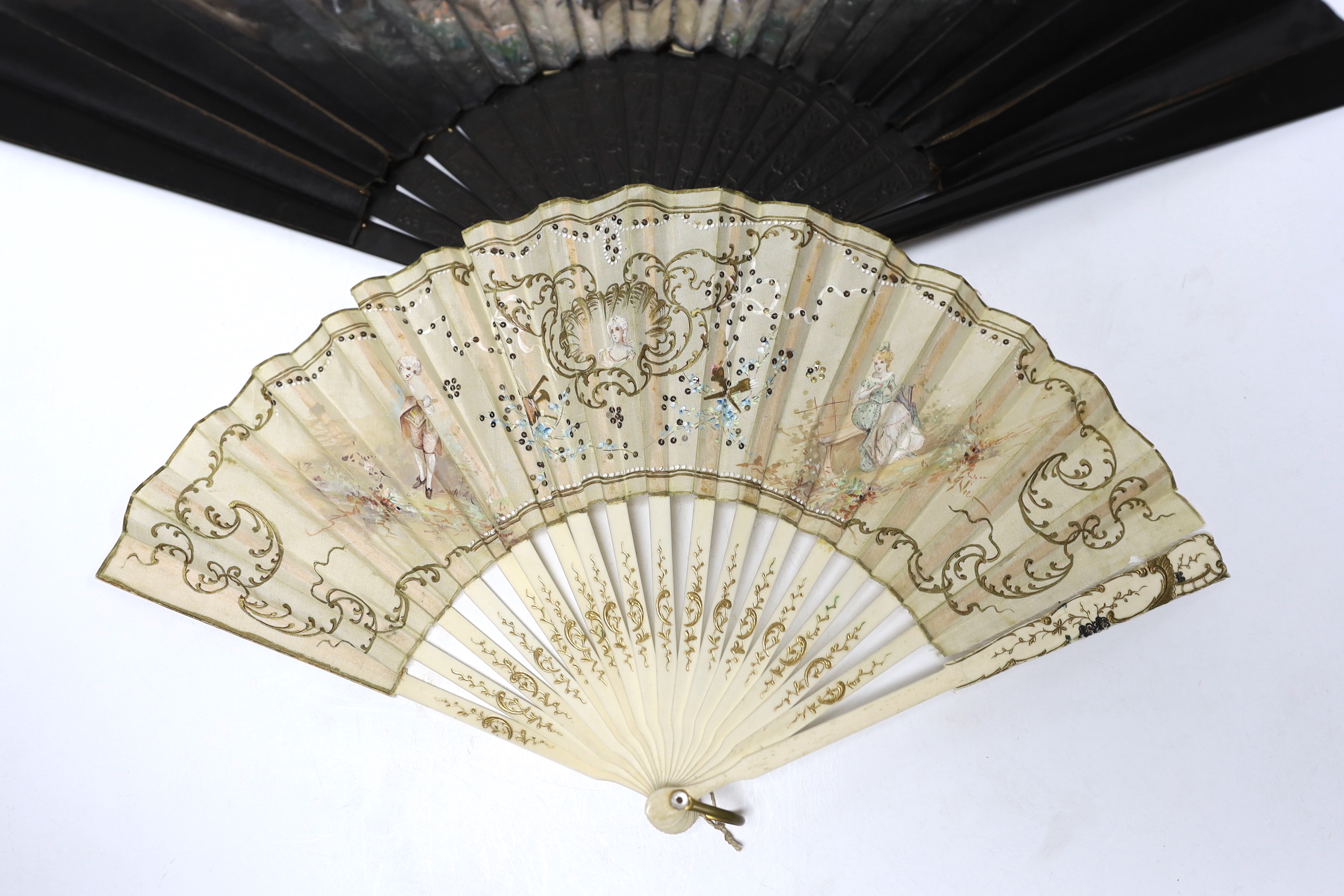 A French 19th century bone and sequin fan and a Spanish figurative leaf fan with ebony guards